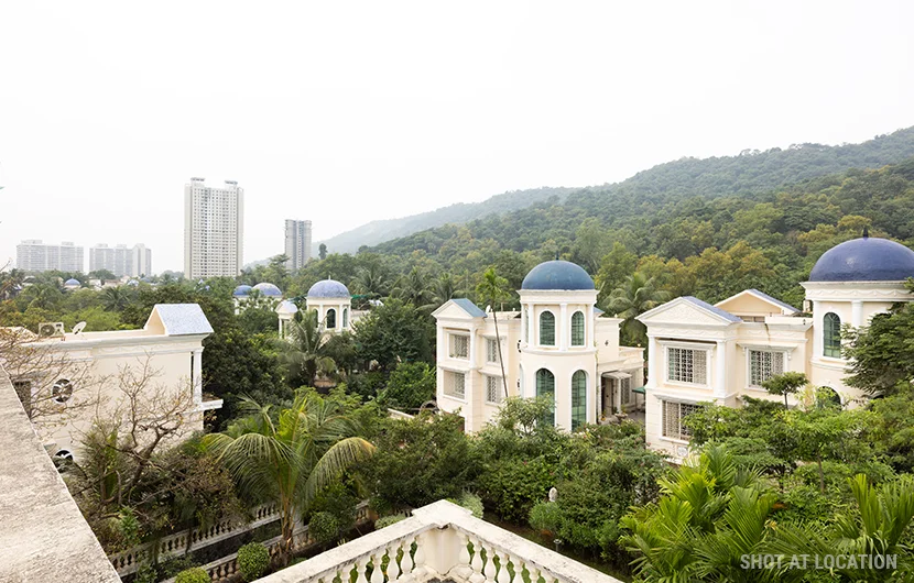 A scenic depiction of residential buildings in a neighborhood, illustrating the blend of styles and community atmosphere.